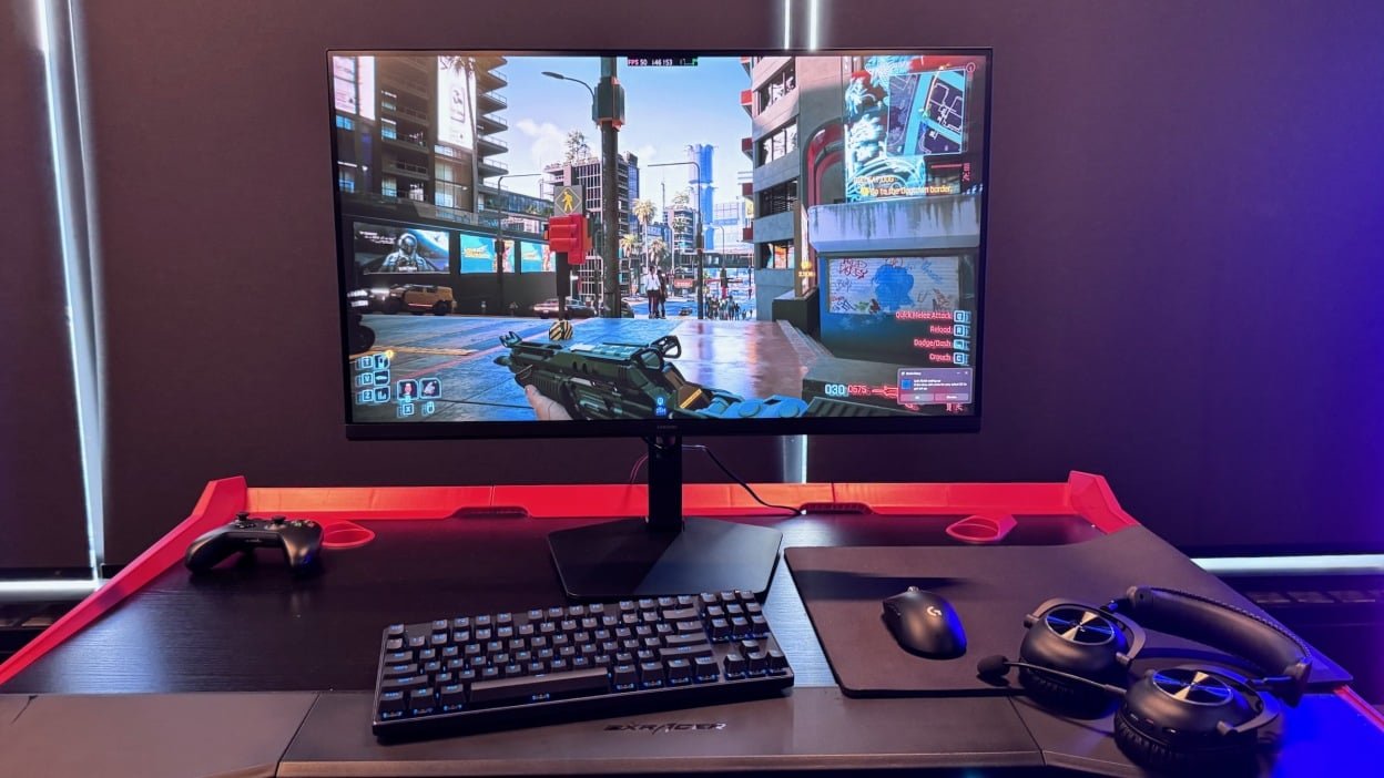 the new Samsung gaming monitor on a desk displaying a video game